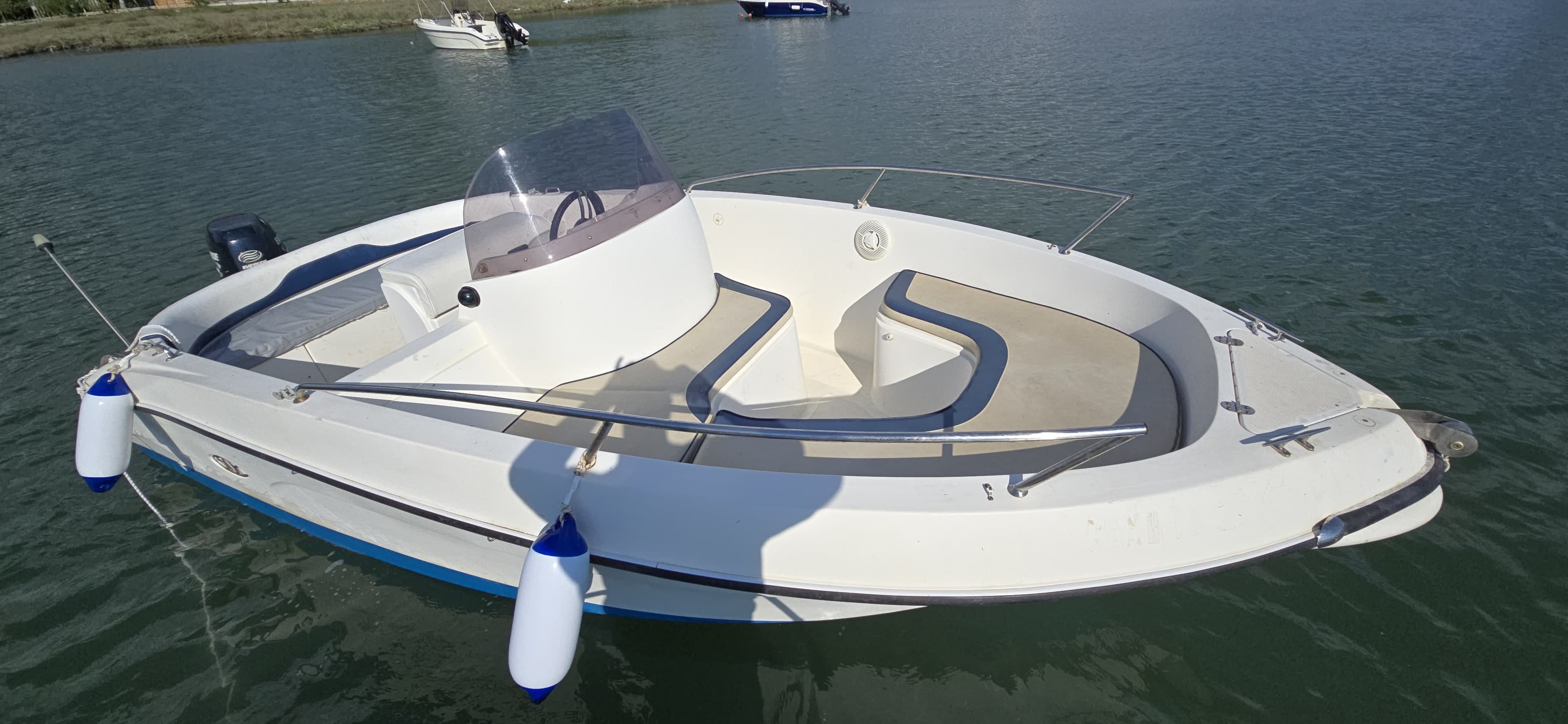 Spacious U-shaped cushioned bow seating on the 5.4-meter Max 2 rental boat, designed for comfortable group trips in Ksamil